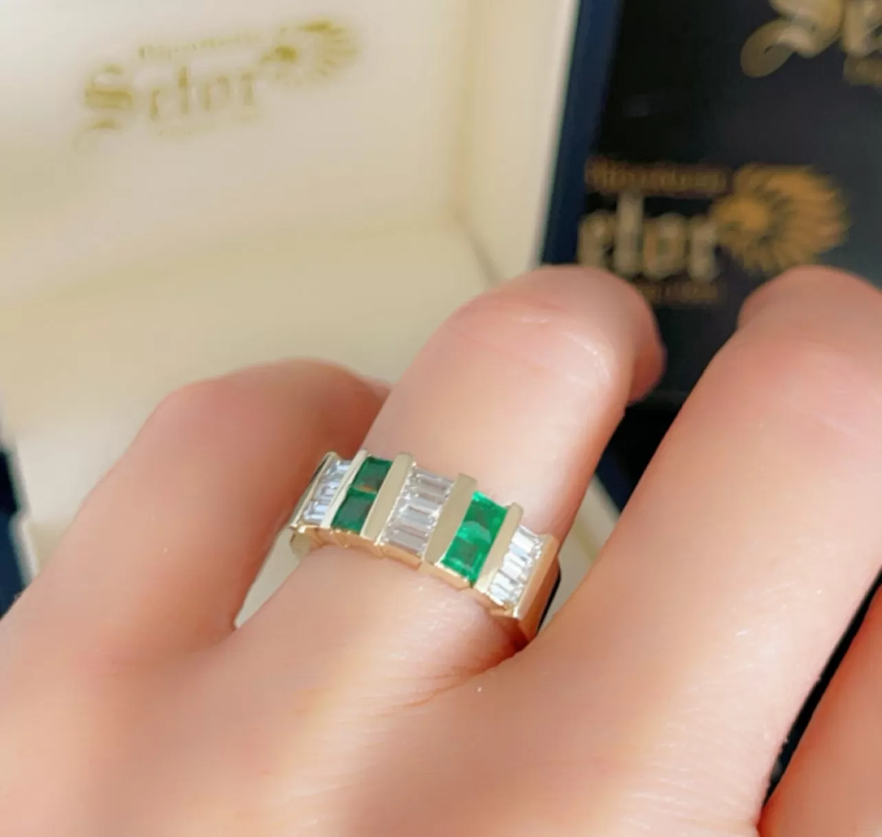 Emeralds and diamonds ring